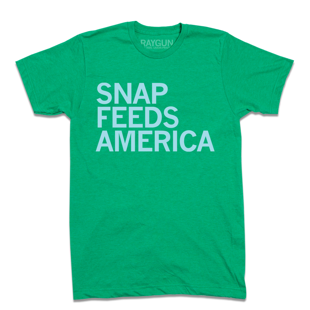 Heather Kelly Green shirt with ice blue text that reads "Snap feeds America"