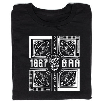 A black, union-made T-shirt featuring a white graphic with the text 1867, BAR, and DRINK LOCAL surrounding a central hop illustration and four corner panels each showing a skull pierced by a dagger.