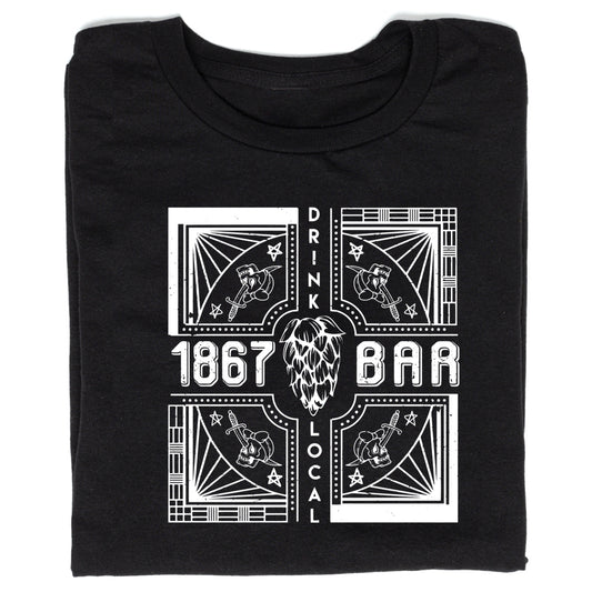 A black, union-made T-shirt featuring a white graphic with the text 1867, BAR, and DRINK LOCAL surrounding a central hop illustration and four corner panels each showing a skull pierced by a dagger.