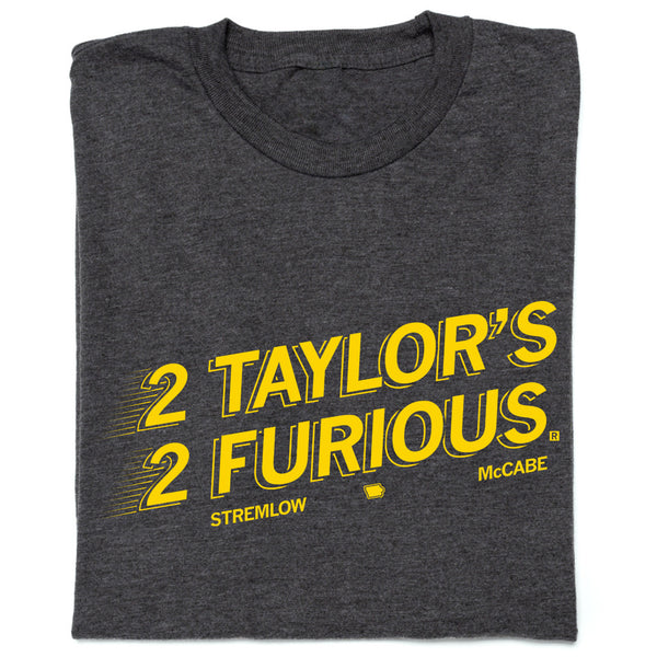 Folded charcoal t-shirt with gold ink text that reads 