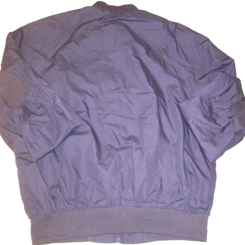 Back view of an XL, plain dark blue Members Only bomber jacket with long sleeves and ribbed cuffs and hem.