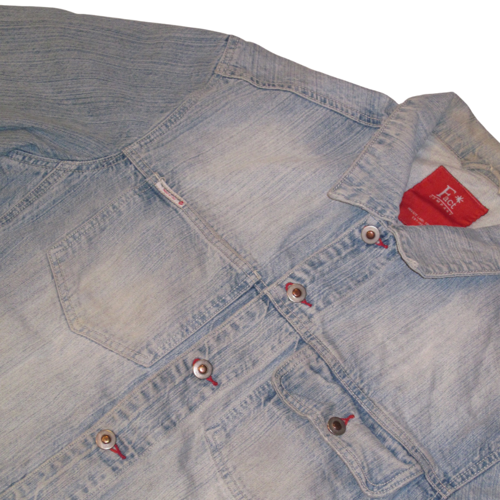 Light blue ethically sourced denim button-up shirt with red stitching detail and a red brand label at the collar.