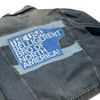 Vintage RAYGUN denim jacket with a back patch that reads, The USA: Belligerent bro of North America!.