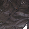 Vintage Outbrook black leather blazer with a button closure and brand label.