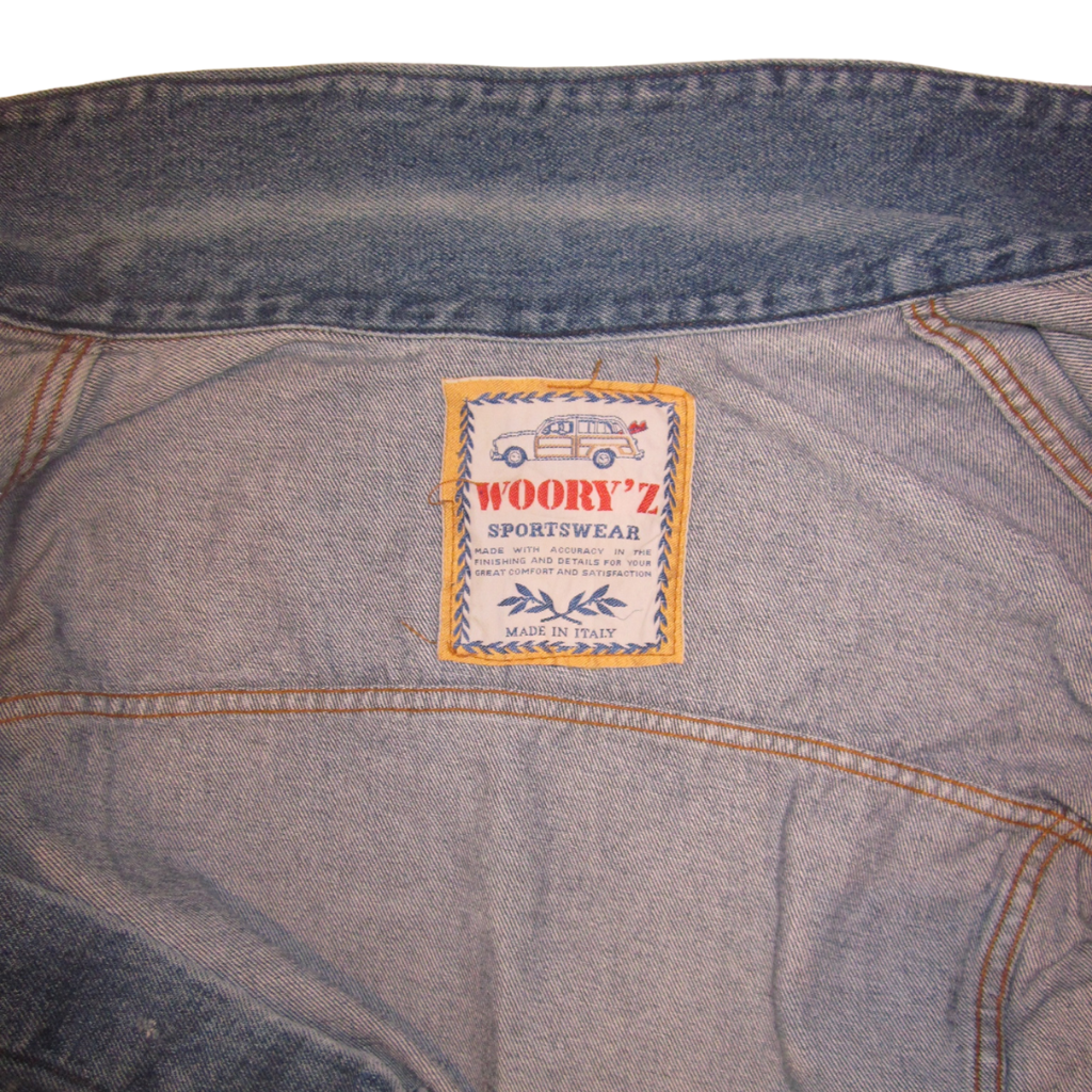 A vintage sportswear denim jacket label featuring a line-art station wagon icon and the text Wooryz Sportswear, Made in Italy.