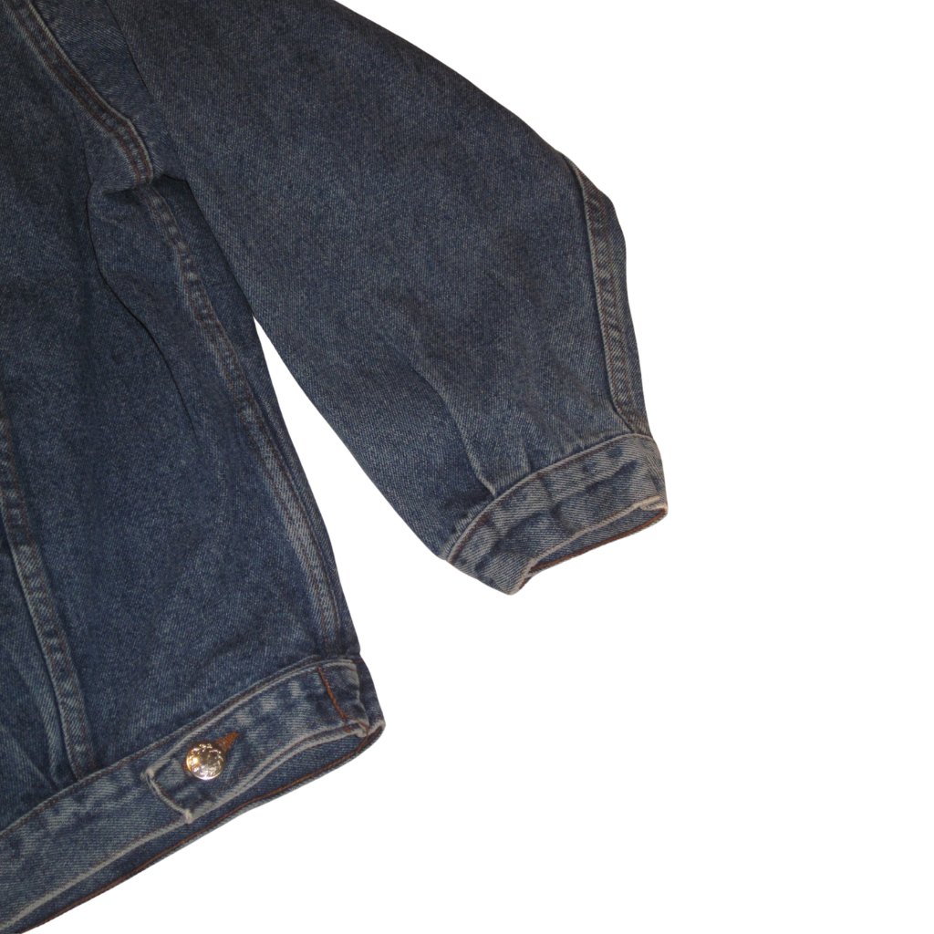 Dark blue vintage sportswear denim jacket sleeve and lower hem with a silver button.