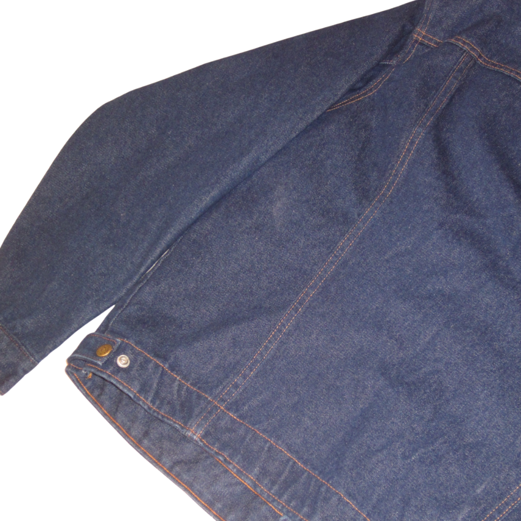 Vintage dark blue Saddle King Western denim jacket with contrast stitching and a metallic button at the hem.