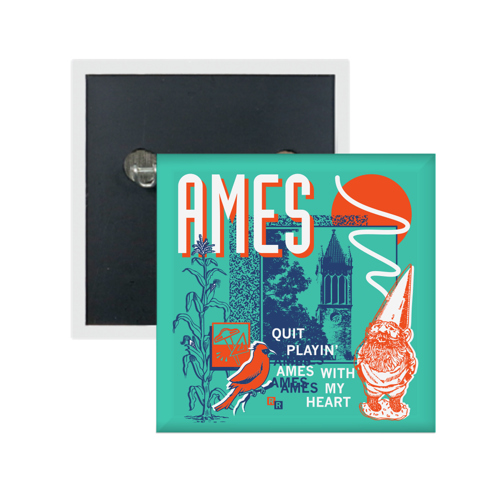 A teal square button in a retro 90's style with a navy print image the campanile in Ames. White & orange text in the top left says, "AMES" and smaller what text to the bottom right reads "quite playin' Ames with my heart." Accents include an orange gnome, orange bird, navy corn, white squiggles, and more.