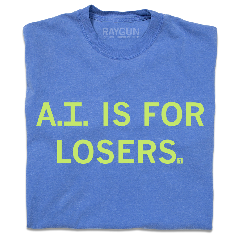 A folded blue shirt with pastel green ink that says, "A.I. is for losers."