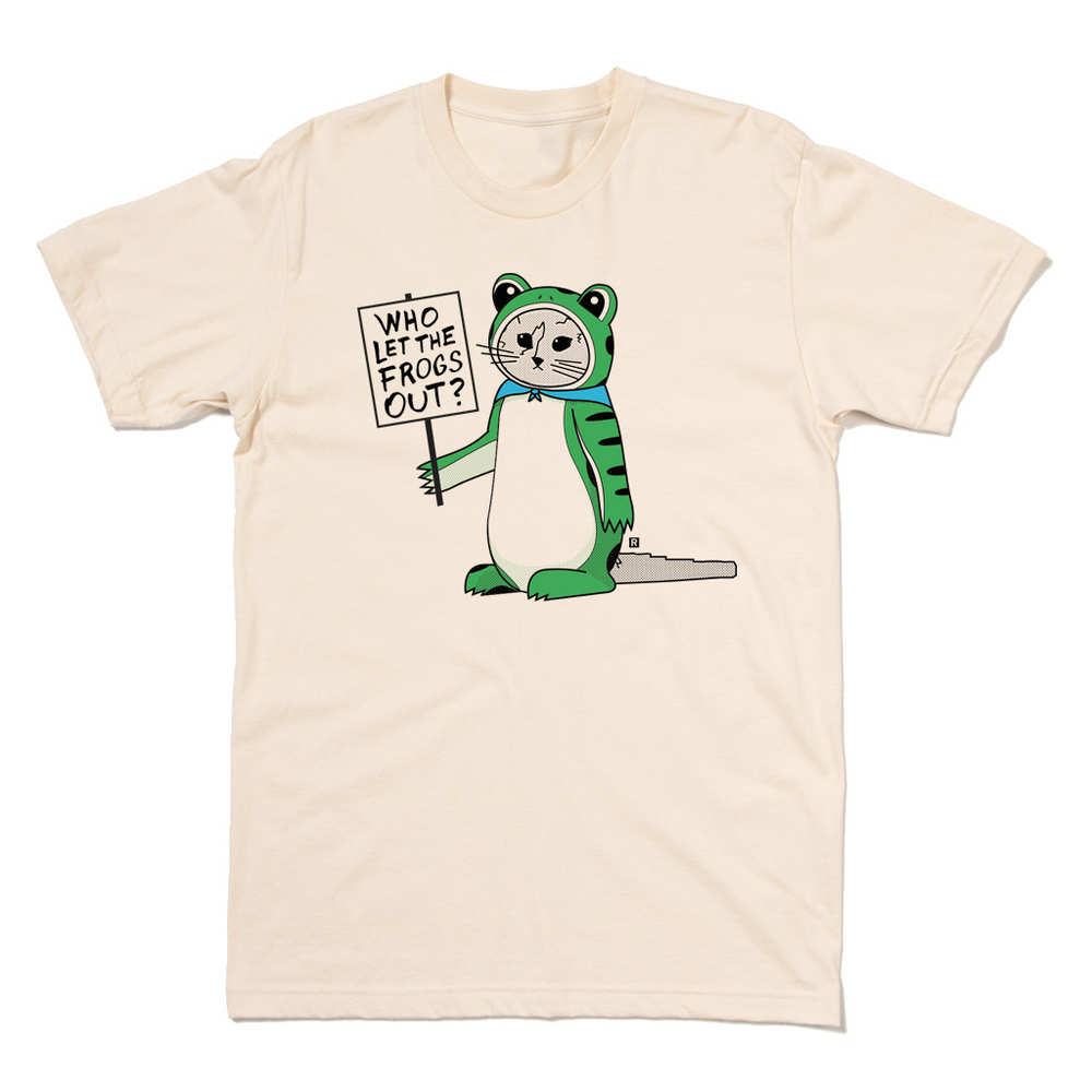 A natural colored t-shirt with RAYGUN's cat mascot, Gary, dressed in a frog costume while holding a sign that says, "Who let the frogs out?"