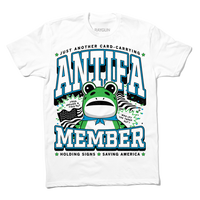 White t-shirt with the blue, black and green text that reads "Just another card-carrying ANTIFA member" above and below an illustration of the Portland protestor in a frog suit. To the sides are an American flag and the text "Frog around & find out. Who let the frogs out?"