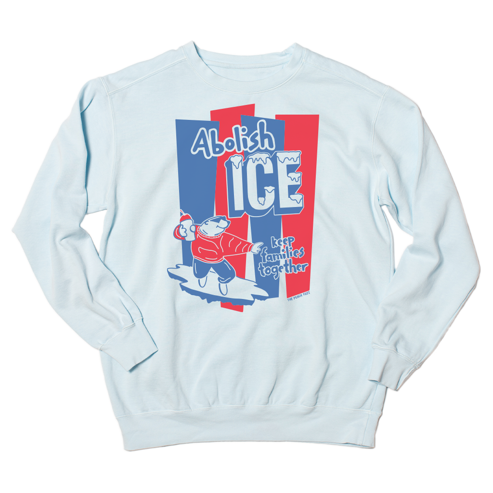 A light blue crew sweatshirt with royal blue and red ink hat reads "Abolish ICE. keep families together" with a polar bear holding a slushee.