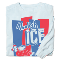 A folded light blue crew sweatshirt with royal blue and red ink hat reads "Abolish ICE. keep families together" with a polar bear holding a slushie.