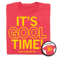 A folded heather red -shirt with centered yellow ink text that says, "IT'S GOOL TIME!" Smaller print below says, "ALEA GOOLSBY" beside a tiny Iowa with the number 30 in it. A small picture in the bottom right shows the back print. The back s laid out like a jersey with "GOOLSBY" printed across the shoulders and a large "30" below.
