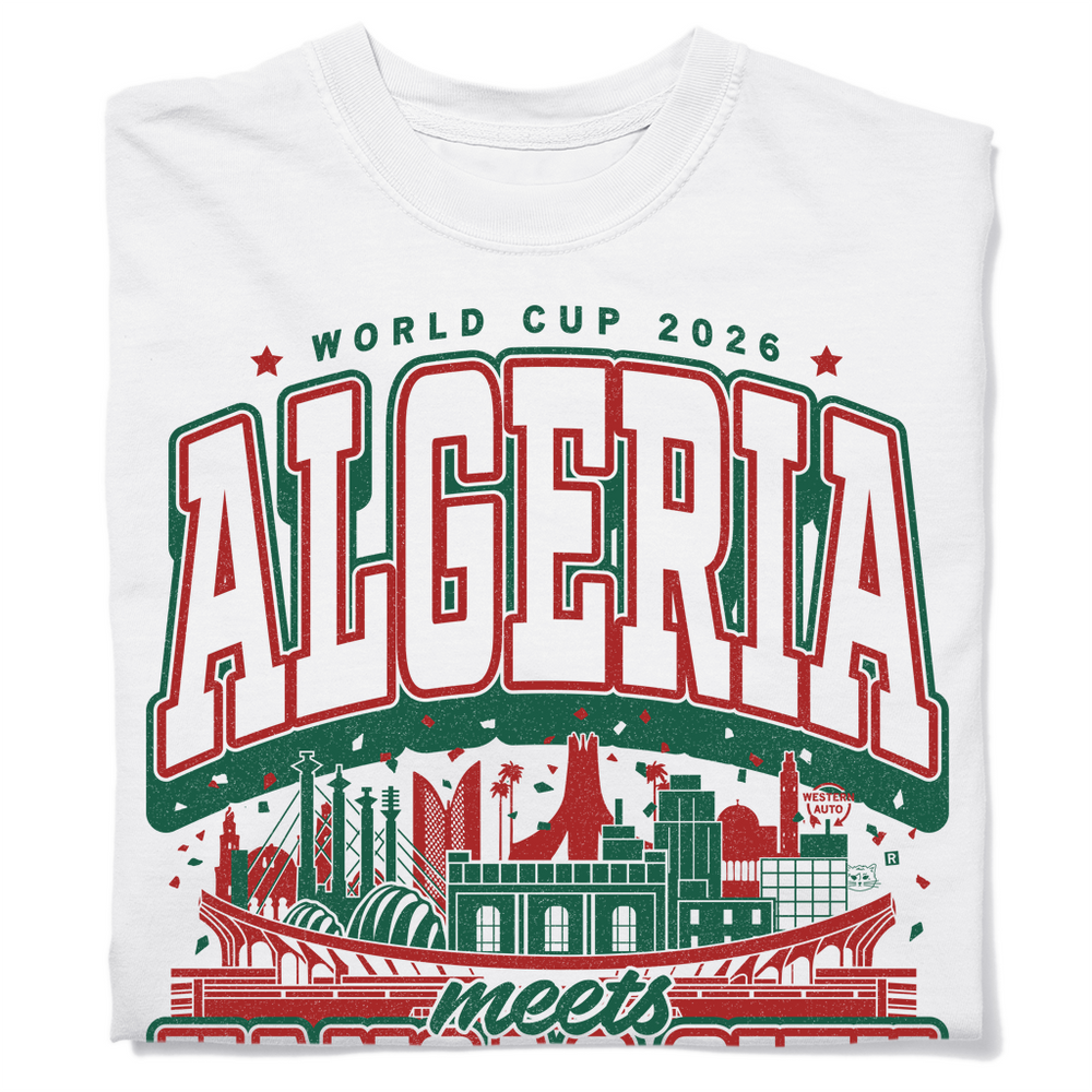 A folded white heavyweight t-shirt with kelly green and red ink. From top to bottom the text reads "World Cup 2026: Algeria meets Kansas City. One two three, viva L'Algerie." In the center is a depiction of notable buildings from Algeria and Kansas City mixed together.