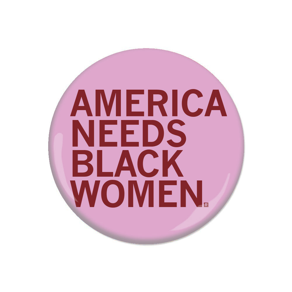 A pink button with left-aligned red text that says, "America Needs Black Women Button"