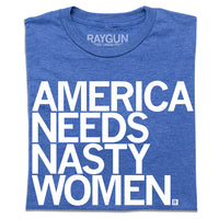 A folded heather royal blue t-shirt with all caps white text that says, "AMERICA NEEDS NASTY WOMEN."