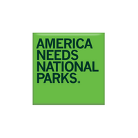 Bright green square magnet with dark green text that reads "America Needs National Parks" in all caps.