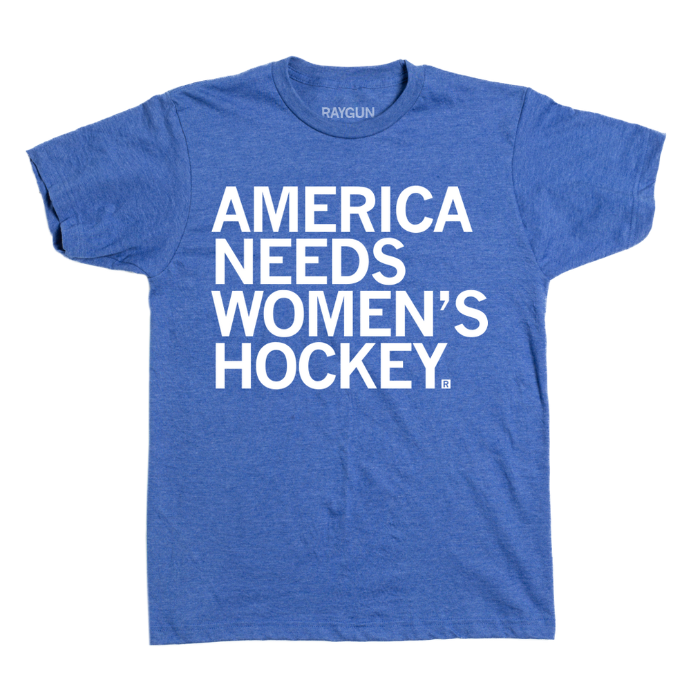 Heather royal tee with left-aligned white ink text that reads "America Needs Women's Hockey"