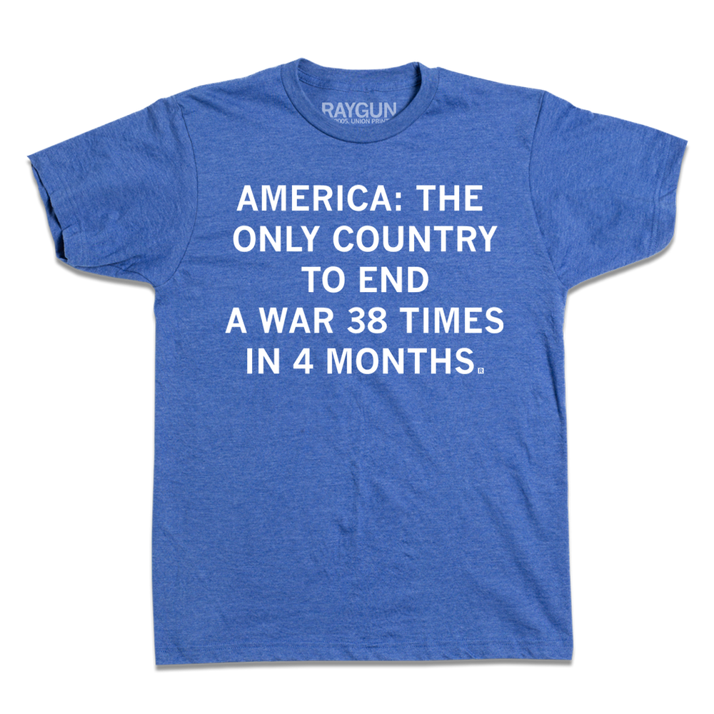 A short sleeve heather royal blue t-shirt with centered white ink that says, "America: The Only Country To End A Ware 38 Times In 4 Months."