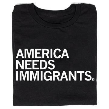 Black union labor t-shirt with the text AMERICA NEEDS IMMIGRANTS printed in white capital letters.