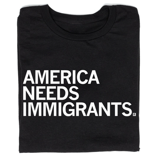 Black union labor t-shirt with the text AMERICA NEEDS IMMIGRANTS printed in white capital letters.