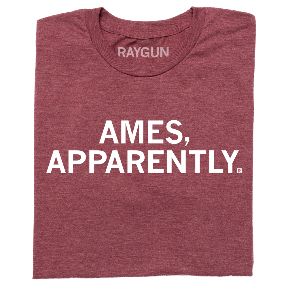 A folded heather maroon t-shirt with centered white ink text that says, "Ames, apparently."
