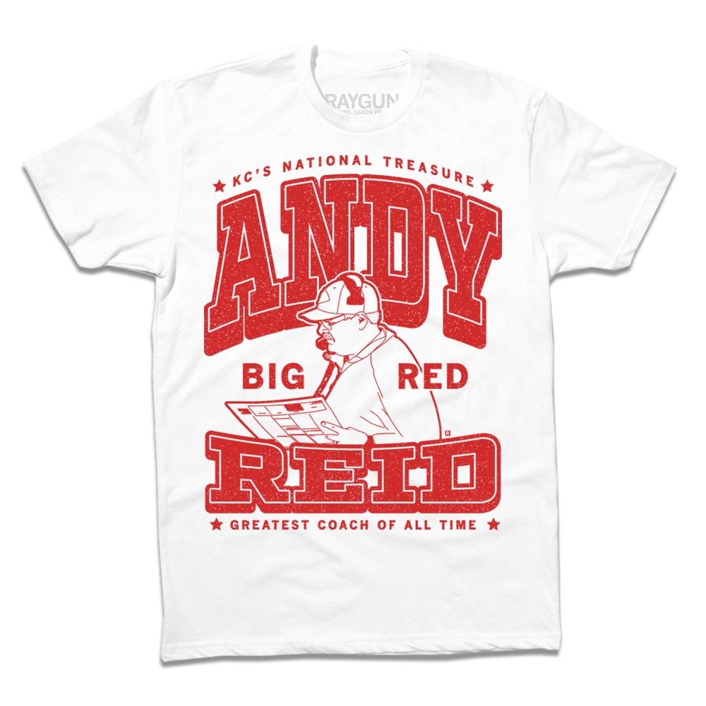 White tee with red text that says, "KC's National Treasure: Andy "Big Red" Reid. Greatest Coach of All Time." with an illustration of Andy Reid reading a play sheet.