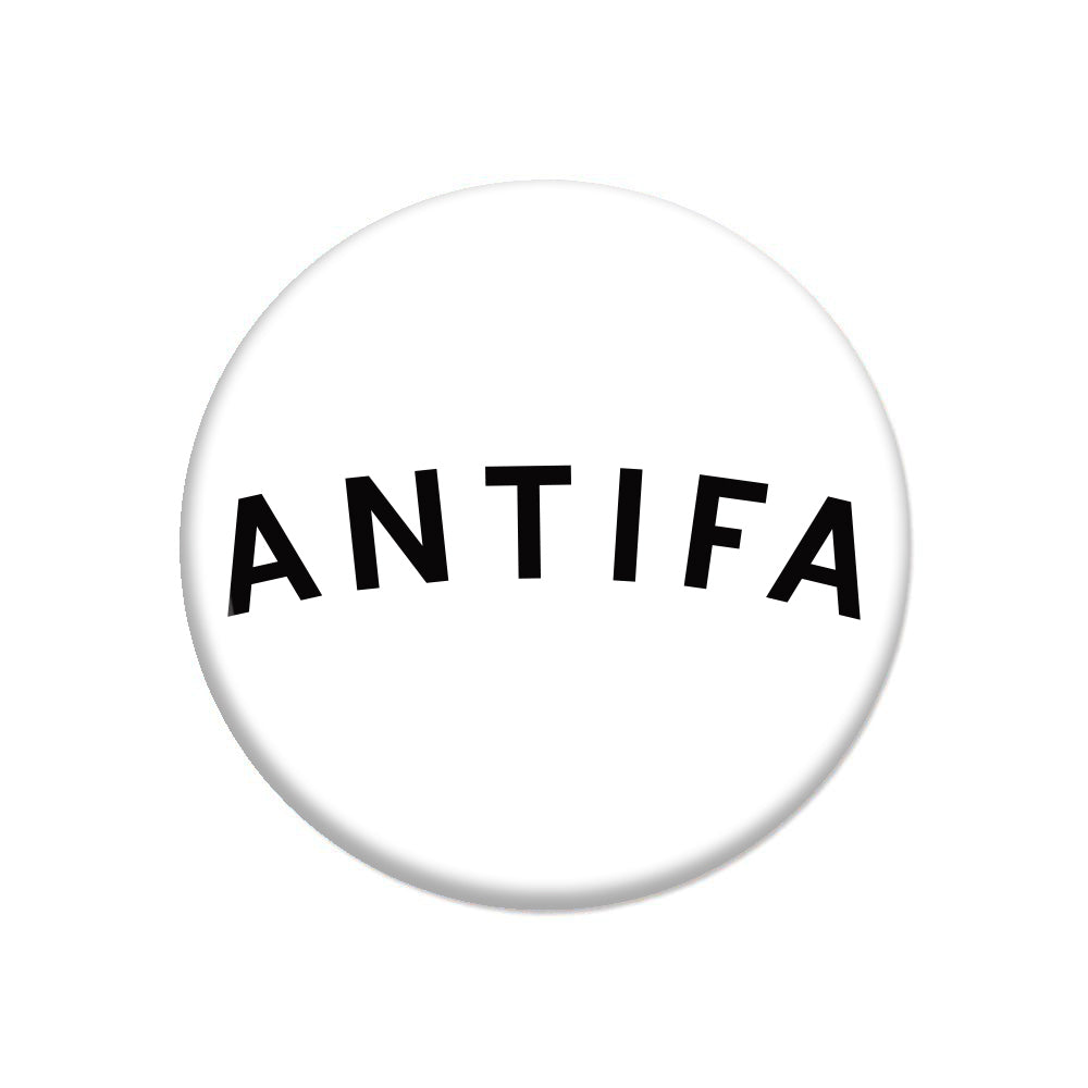A circular white RAYGUN pin button with the word ANTIFA in black capital letters arched across the center.