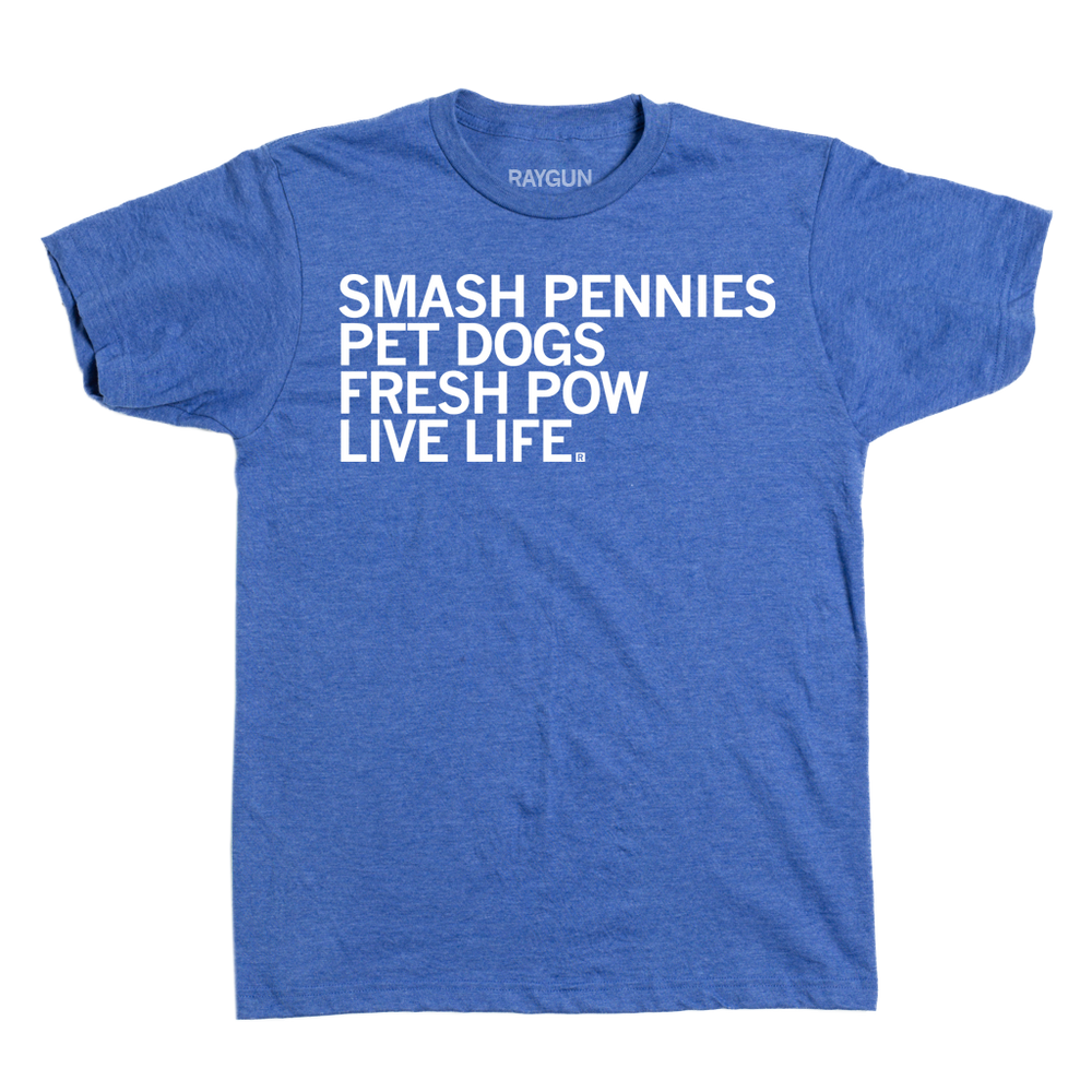A heather blue shirt with left-aligned white ink that reads "Smash pennies, pet dogs, fresh pow, live life"