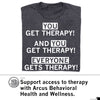 Dark gray RAYGUN t-shirt featuring the white text YOU GET THERAPY! AND YOU GET THERAPY! EVERYONE GETS THERAPY! above a logo and text supporting Arcus Behavioral Health and Wellness.
