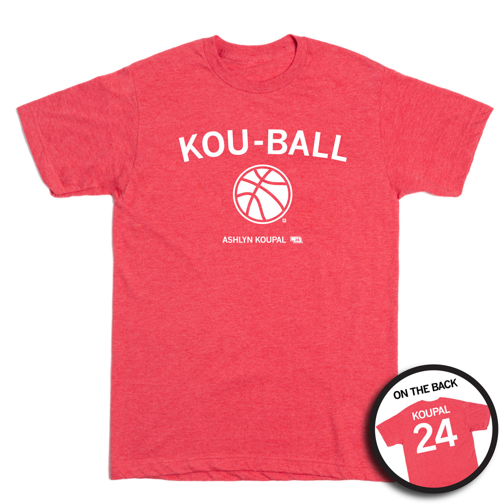 Short sleeve heather red shirt with white print that says, "KOU-BALL" above a basketball. Smaller text below reads "ASHLYN KOUPAL" beside a small outline of Nebraska. The back print is laid out like a jersey with "KOUPAL" printed across the shoulders above the number 24.