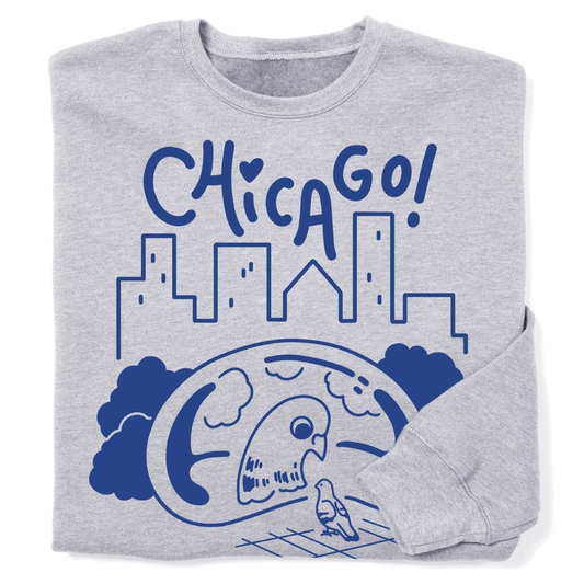 Folded heather grey crew neck sweatshirt with blue ink depicting a pigeon looking at its reflection in Cloud Gate with a skyline in the background and "Chicago" above.
