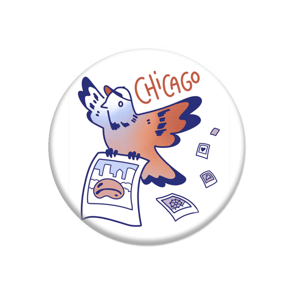 A white circular button with red and blue print depicting a pigeon with a baseball hat flying while carrying a polaroid of the Cloud Gate with polaroids of other Chicago icons falling behind it.