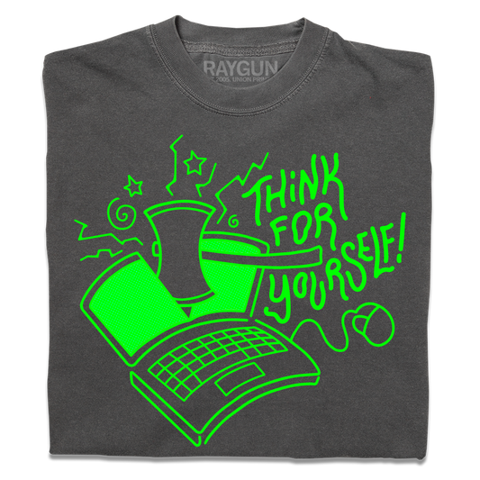 A folded heavyweight grey t-shirt with a bright green ink illustration of a laptop being cut in half by an axe and text to the right that says, "Think For Yourself!"
