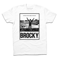 White shirt with a black ink image spoofing Rocky, depicting Brock Purdy looking over his old college stadium. Above him with his fists raised in the air is the text "His whole life was a million to one shot"