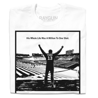 A folded white t-shirt with a black ink image spoofing Rocky, depicting Brock Purdy looking over his old college stadium. Above him with his fists raised in the air is the text "His whole life was a million to one shot"