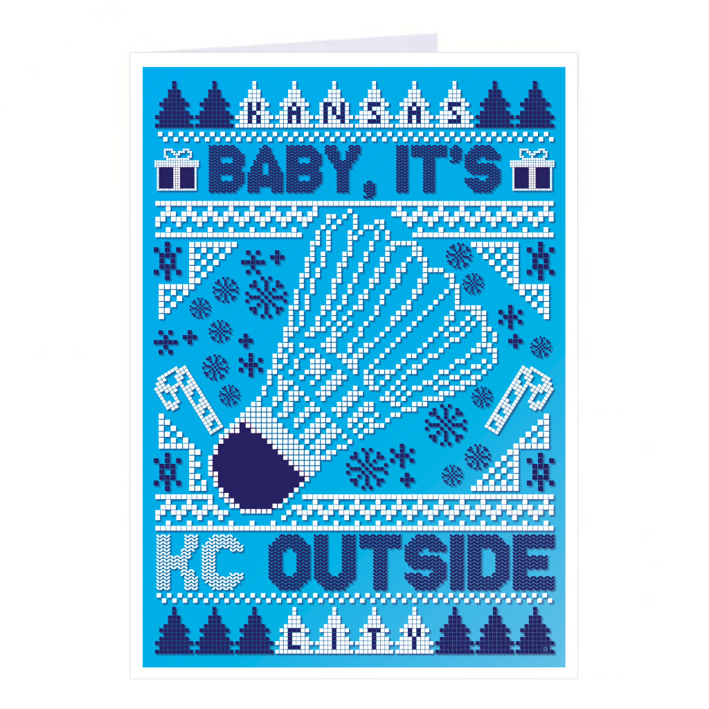 Holiday greeting card with a pixelated blue and white knit pattern featuring a shuttlecock in the center and the text Kansas City, Baby, It’s Cold Outside. This RAYGUN design is made in the USA.