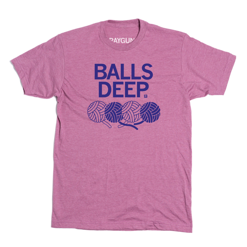 Heather cassis RAYGUN t-shirt with BALLS DEEP printed above an illustration of four yarn balls.