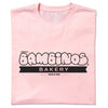 Light pink Donna’s Bambinos Bakery t-shirt with a black logo that reads Made in Iowa.
