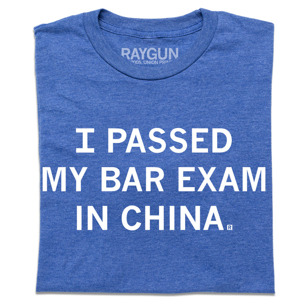 Folded heather royal blue t-shirt with centered white ink text that says, 