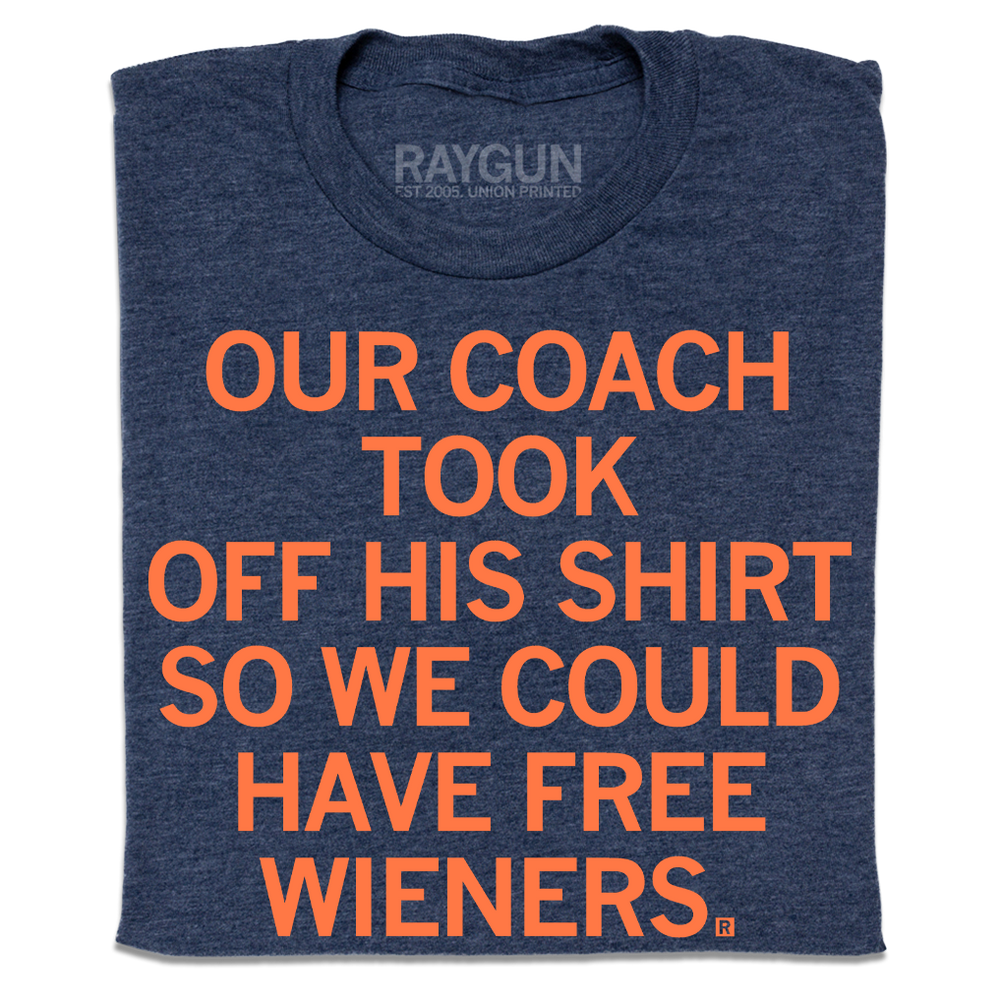 A folded heather navy t-shirt with orange print text that says, "Our coach took off his shirt, so we could have free wieners"