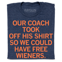 A folded heather navy t-shirt with orange print text that says, "Our coach took off his shirt, so we could have free wieners"