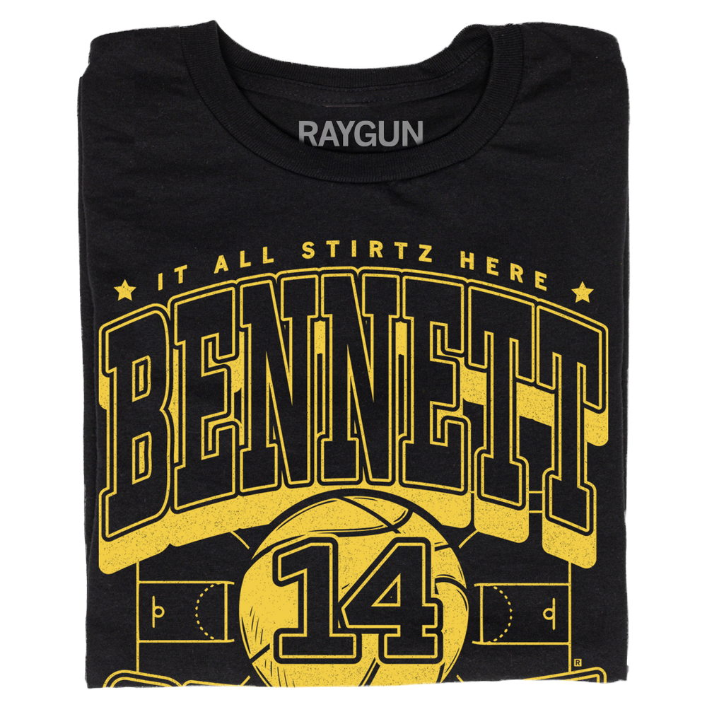 Black t-shirt with gold ink that reads "It all Stirtz here. Bennet Stirtz. Guard. Liberty, Missouri" over an illustration of a basketball court with a giant basketball in the center and the number 14.
