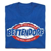 A folded royal blue t-shirt with red and white in that says, "Bettendorf: Home of the Blizzard. For real, look it up."