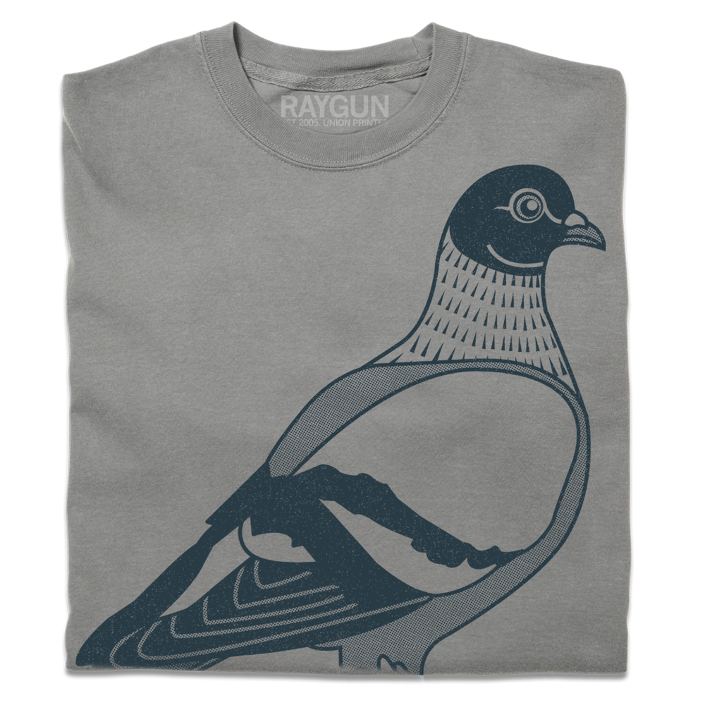 A folded grey heavyweight t-shirt with denim colored ink depicting a giant pigeon with it's wings tucked back.