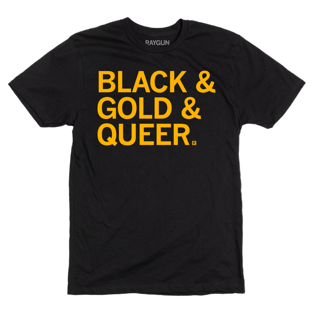 A short sleeve black t-shirt with gold ink text that says, "Black & Gold & Queer"