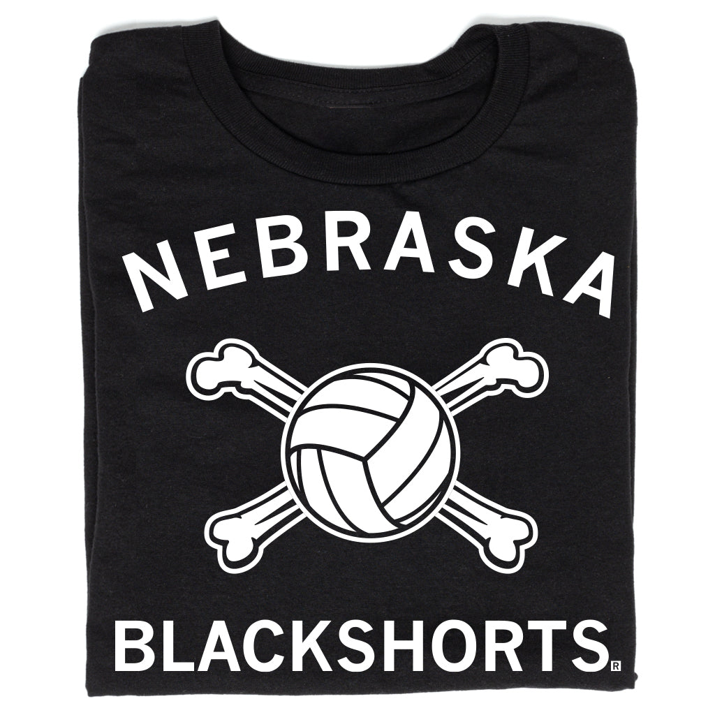 Black t-shirt with white text reading NEBRASKA above a volleyball crossed with two bones, and BLACKSHORTS below.