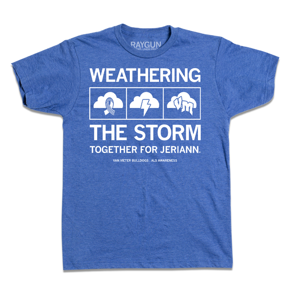 Short-sleeve heather royal blue t-shirt with center white ink text that says, "WEATHERING THE STORM TOGETHER FOR JERIANN." with the period as a heart. "VAN METER BULLDOGS. ALS AWARENESS" is printed in smaller text below. In the center of the text are three squares with clouds. The cloud to the left has a ribbon, there's lightning in the center cloud, and "VM" in the third cloud.