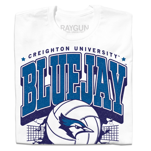 White Creighton University Bluejay volleyball t-shirt featuring blue text, a graphic of a volleyball, and the mascot logo in front of a net.